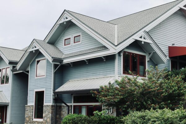 Charming blue house exterior with modern architectural features in Asheville, NC.
