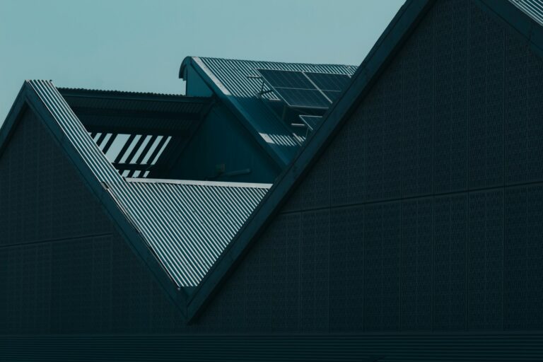 the roof of a building with a clock on it